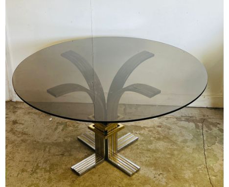 A vintage circular glass dining table on a chrome base and brass by Banci and Fireaze (H72cm Dia130cm)