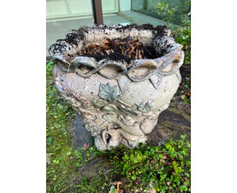 A glazed ceramic planter with platted design around the top and natural scene including a clock in a molar shape AF (H56cm W5