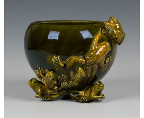 A green glazed pottery jardinière, late 19th Century, designed by Christopher Dresser, manufactured by Linthorpe or Ault, the