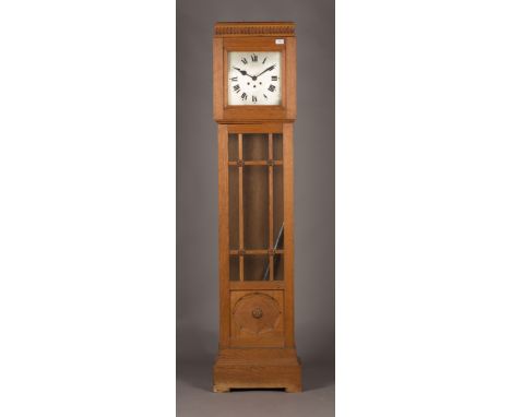 An early 20th Century Arts and Crafts style oak longcase clock with eight day chiming movement, the square dial with Roman nu