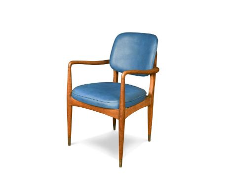 A mid-century Danish oak elbow chair, with gently curving arms into tapering cylindrical legs with brass caps87 x 52 x 51cmPl