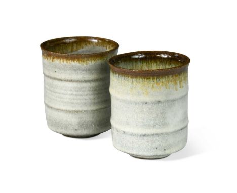 § Louis Hanssen (1934-1968), a pair of stoneware beakers, each of ribbed cylindrical form and with tenmoku glazed rims breaki