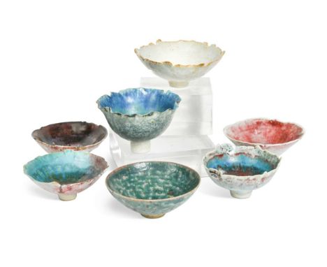 § Derek Davis (1926-2008), a group of seven stoneware footed bowls, each of small scale, variously glazed and six having irre