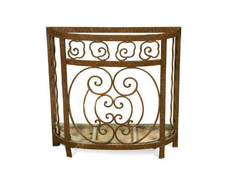 In the manner of Edgar Brandt (1880-1960), a wrought iron stick stand, of demi-lune outline with open work front and original