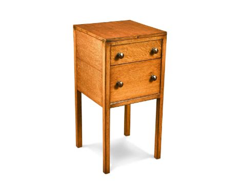 A Heal's Art Deco oak side table, the fold-open top revealing a well within above a false drawer and deeper drawer below rais