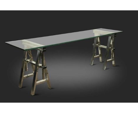 A contemporary glass and chrome trestle console table, the rectangular glass top on height adjustable A-frame trestle support