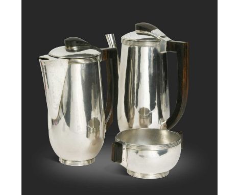 A silver three-piece café au lait set by John Leslie Miller Auld, London 1938, each with spot-hammered finish and reeded rims