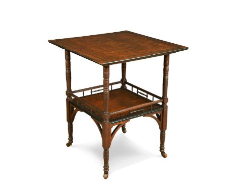 An Aesthetic period two-tier ash and rosewood occasional table, the crossbanded square top on ring-turned supports and a gall