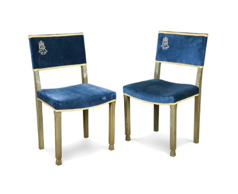 A pair of Elizabeth II limed oak Silver Jubilee chairs, 1977,  upholstered in blue velvet, with plaque inscribed 'Replica of 