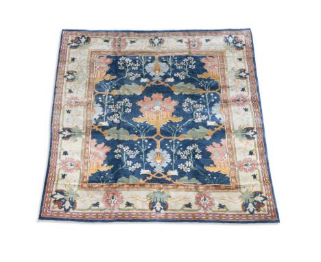 Liberty & Co., an Arts & Crafts style carpet, modern, with central stylised floral motifs surrounded by blossom on central bl