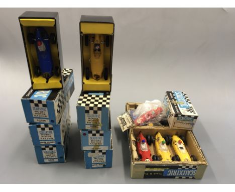 Scalextric boxed model cars and spare parts, including Lotus MM/C63, Aston Martin MM/C.57, C62 Ferrari, etc, eleven cars in t