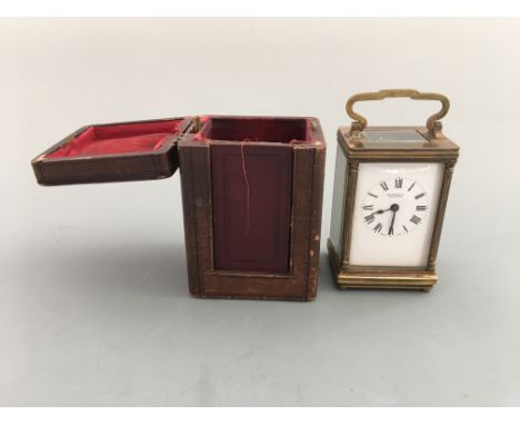 A Cooper & Co. Worcester miniature carriage clock in leather case. Height 12.5cm.