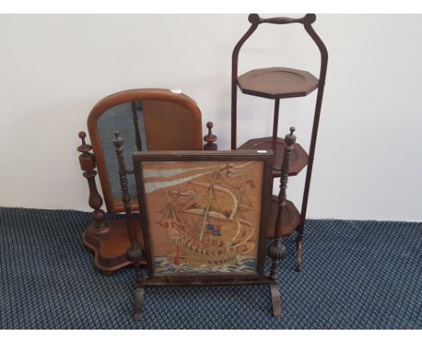 A Victorian mahogany swing mirror, glazed fire screen depicting a galleon and three tier cake stand.