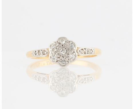 A diamond flower design ring, set with eight-cut diamonds in flower pattern with additional diamond accents to shoulders, sta