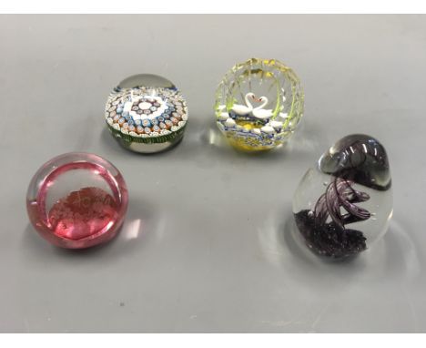 Four paperweights, one Caithness Royal Swans 2011 limited edition 32/40, Caithness ruby 40th Anniversary of Elizabeth II’s ac