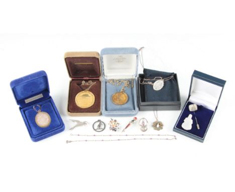 A collection of jewellery, to include pendants and chains, brooches, an Oriental carved hardstone pendant, a tie pin, some it