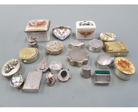 A collection of pill boxes, including silver, ceramic thimbles etc.