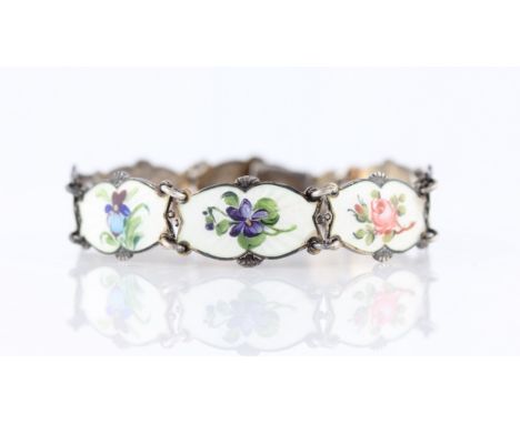 A Norwegian enamel bracelet, each articulated link featuring flower design on white guilloche enamel background, stamped Ster
