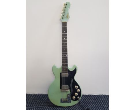 A Hofner 1960's style electric guitar, pea green, number stamp 1601.