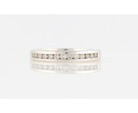 An 18ct white gold diamond half eternity ring, channel set with thirteen round brilliant cut diamonds, total diamond weight a