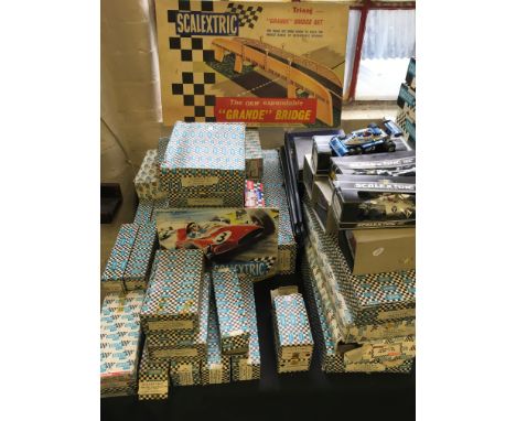 A collection of Scalextric vehicles and parts including ‘Grande’ Bridge set, C.124 Ferrari 312 T, C 026 March Ford 721, outer