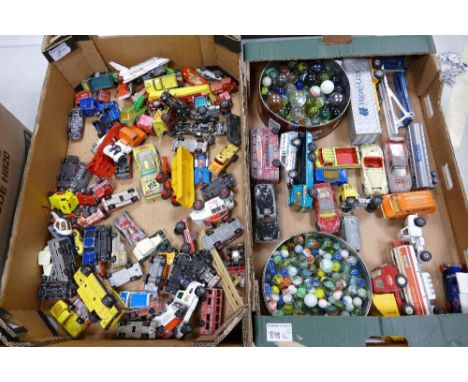 A large collection of used Corgi, Matchbox &amp; similar die cast vehicles: together with 2 boxes of vintage marbles(2 trays)