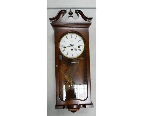 Mahogany Cased Wall Clock by Comitti of London: Key wind, pendulum, Westminster chime, height 61cm 