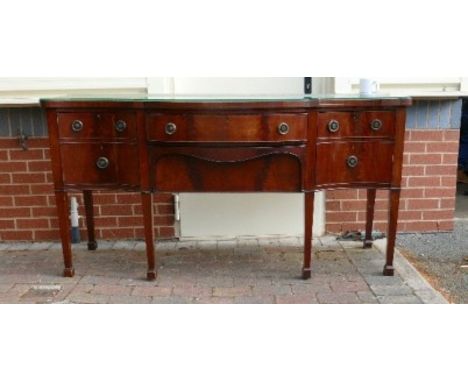 Regency Mahogany bow front sideboard on tapered legs and spade feet: length 165cm, depth 71cm &amp; height 92cm. 