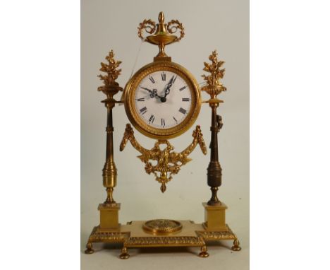 French Empire style gilded brass mantle clock; Not in working order, measuring 36cm high appx.  Mid 20th century.  Movement s