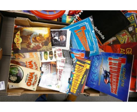 A mixed collection of item to include: ITC Thunderbirds story file, vintage sticker packs, postcards etc 