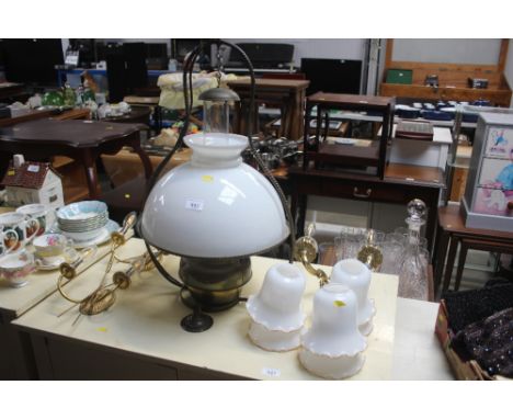 A brass and milk glass shade hanging oil lamp; together with a pair of wheat decorated wall lights etc
