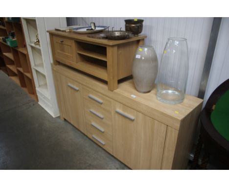 A light oak effect sideboard; together with a light oak effect TV stand