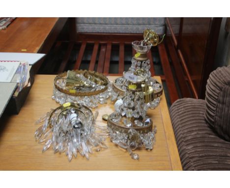 Four brass light fittings with glass drops