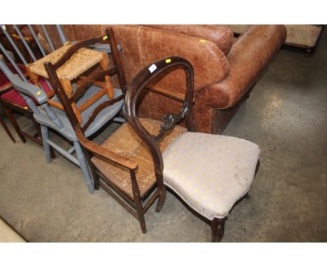 A Victorian rosewood dining chair; together with a ladder back carver chair 