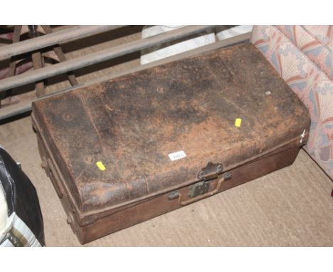 A tin trunk and content of various tools
