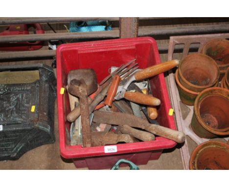 A box of various hand tools