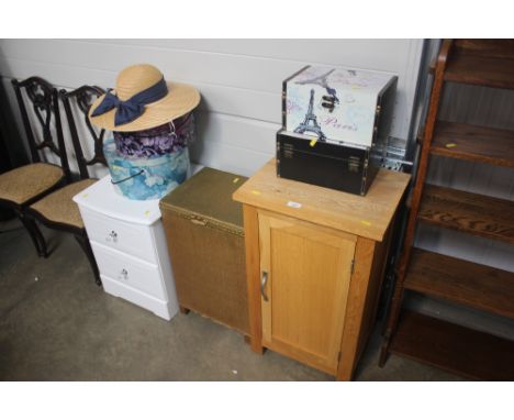 A light oak pot cupboard; together with a loom linen basket; and a white painted bedside chest fitted two drawers; two storag