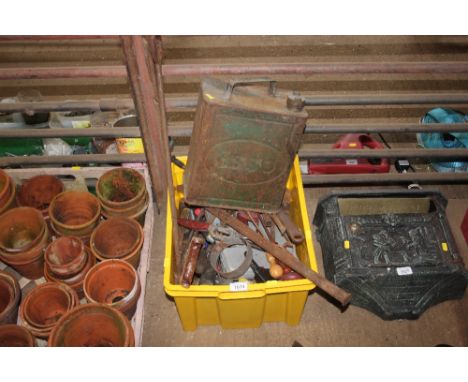 A quantity of various hand tools and an Esso fuel can