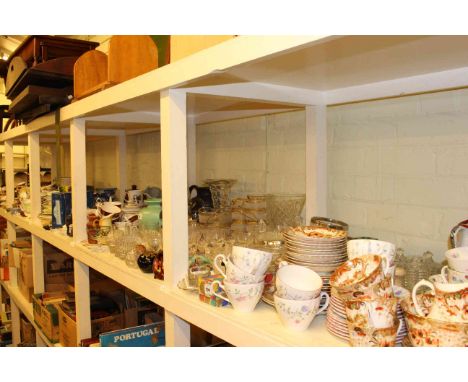 Full shelf of teawares, dinnerwares, glassware and various china