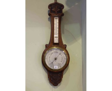 Carved oak aneroid barometer