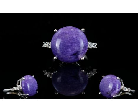 Russian Charoite and White Topaz Ring, a round cut of 14.5cts of the rare, mottled purple stone, charoite, mined only in Russ