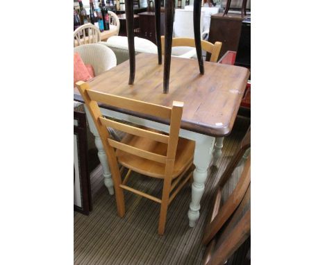 A part painted table of square form together with two beech ladder back chairs