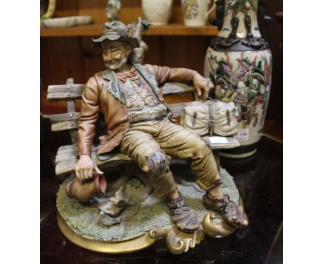 Capo di Monte figure, tramp on a bench together with an Oriental vase