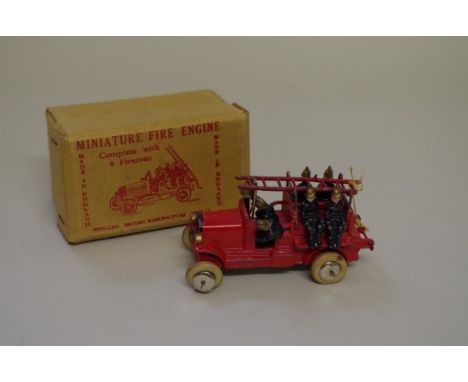 A vintage Johillco miniature fire engine,&nbsp;complete with six firemen, bell and ladder, in original box. 