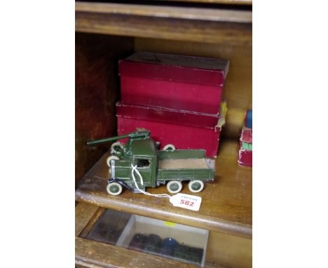 A W Britain 2 Pounder mobile Anti-Aircraft Gun;&nbsp;together a W Britain Army Six Wheel Lorry with driver, both in original 
