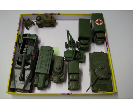 A collection of unboxed Dinky military vehicles, to include: 7.5cm Tank Destroyer; two Scout Cars with drivers; Field Artille