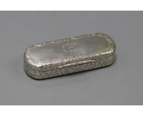 A Victorian engraved silver oval snuff box with silver gilt interior by Nathaniel Mills, Birmingham, 1843?, 89mm.