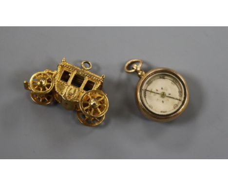 A late Victorian 15ct gold and carnelian set compass fob and a later 9ct gold carriage charm.