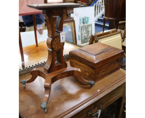A Regency rosewood and marquetry inlaid teapoy, the sarcophagus caddy top opening to reveal two wells and four compartments (