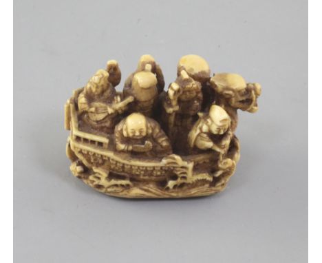 A Japanese ivory netsuke of the Takarabune (treasure ship) 19th century, signed Kagetashi, with the seven Gods of Happiness a